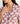 Pijama Camisero Flores de Lounge con estampado floral, manga corta y bolsillo frontal.