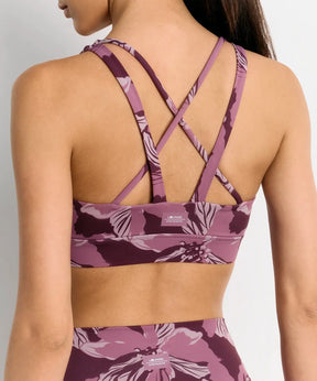 Peto Deportivo Flores Active de Lounge, diseño de flores en tejido elástico y espalda cruzada, ideal para entrenamientos.