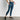 Calza Deportiva Estampado Hojas Active de Lounge, con diseño de hojas, bolsillo lateral y pretina cruzada.