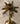 Candelabro Palmera de Lounge, acabado metalizado con diseño de palmera, 34 cm de alto.