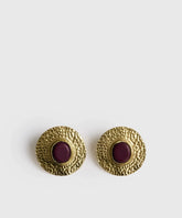 Aros Círculo Machacado de la marca Lounge, con acabado dorado y piedra de resina color púrpura.