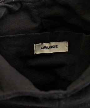 Interior de la Mini Cartera Velvet Fiesta de Lounge con etiqueta visible.