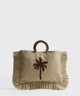 Mini Cartera Vuelos Paradiso de Lounge, cartera pequeña con diseño de palmera y asas de madera.