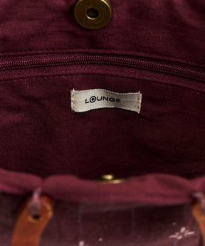Interior de la Mini Cartera Vuelos Paradiso de Lounge con etiqueta visible.