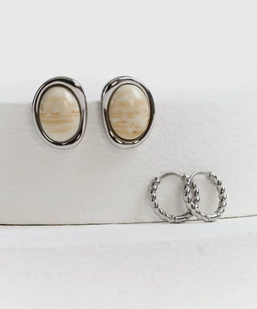Set Aros Piedra de acero inoxidable por Lounge, incluye aros con diseño trenzado y piedra al centro.