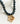 Collar Charm Street de piedras oscuras con colgante metálico de flor de la marca Lounge.