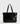 Bolso Notebook Charol Eyelets de Lounge, charol negro con eyelets y detalles metálicos, ideal para notebooks de hasta 15 pulgadas.