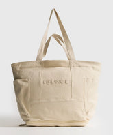 Bolso Playero Antiarena beige de Lounge con múltiples bolsillos, cierre SBS y doble asa.