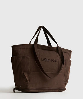 Bolso Playero Antiarena de la marca Lounge, con múltiples bolsillos y diseño cómodo para la playa.