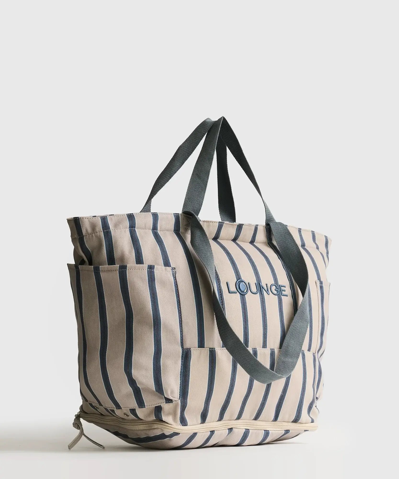 Bolso Playero Antiarena de Lounge con múltiples bolsillos y asas para llevar cómodamente.