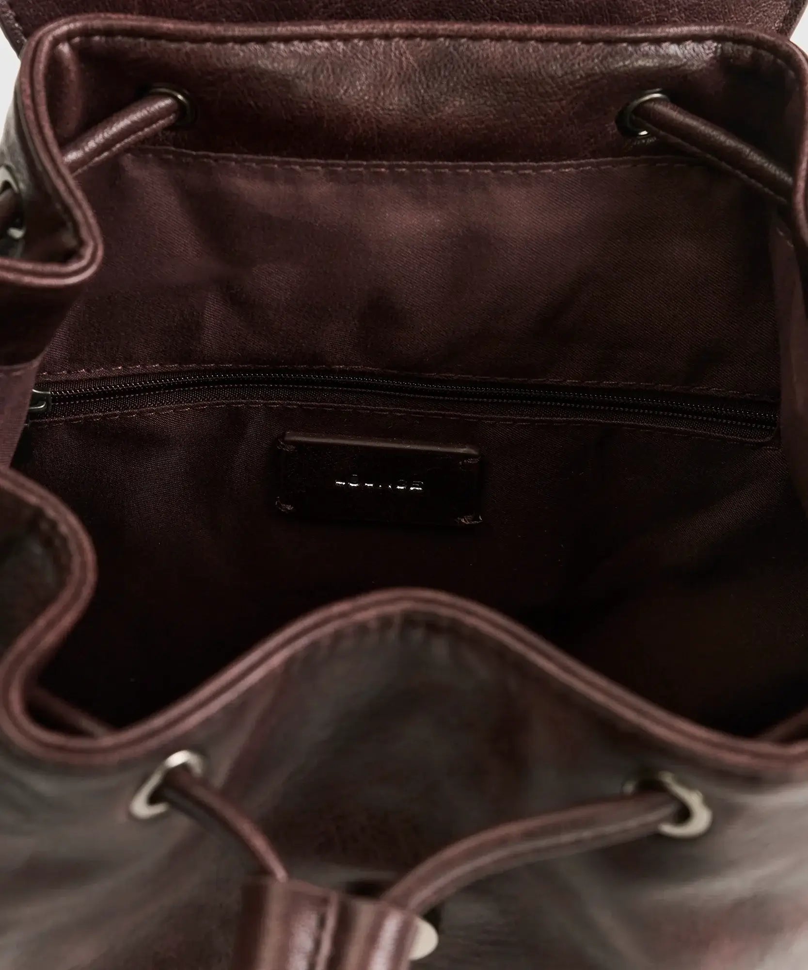 Interior view of Mochila Icons Woman by Lounge featuring adjustable cord closure and zipped pocket.