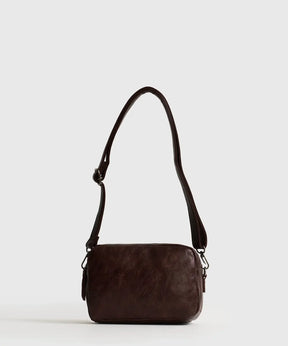 Cartera Bandolera Icons Woman color café de Lounge con dos compartimentos y strap ajustable y removible.