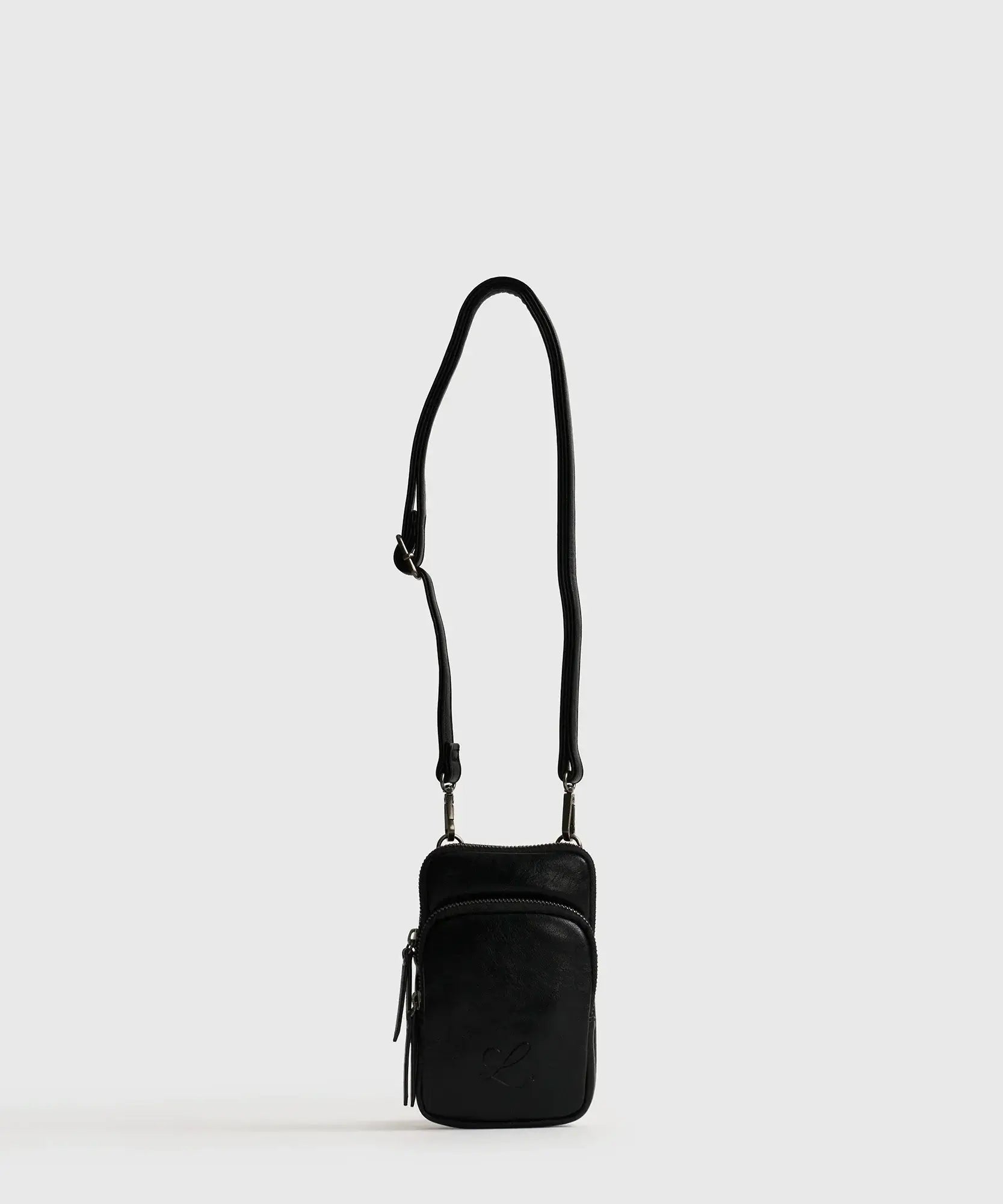 Mini Cartera Icons Woman de Lounge, color negro, con strap ajustable y bolsillo frontal.