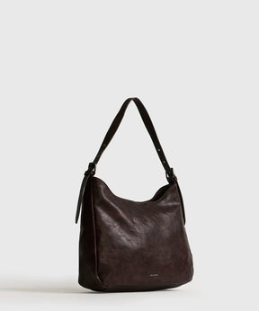 Cartera De Hombro Eclat de Lounge, bolso cuadrado con strap ajustable y amplio compartimento.