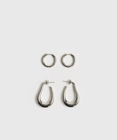 Set Aros Argollas Acero Inoxidable Woman de Lounge, incluye aros alargados y pequeños en color plateado.